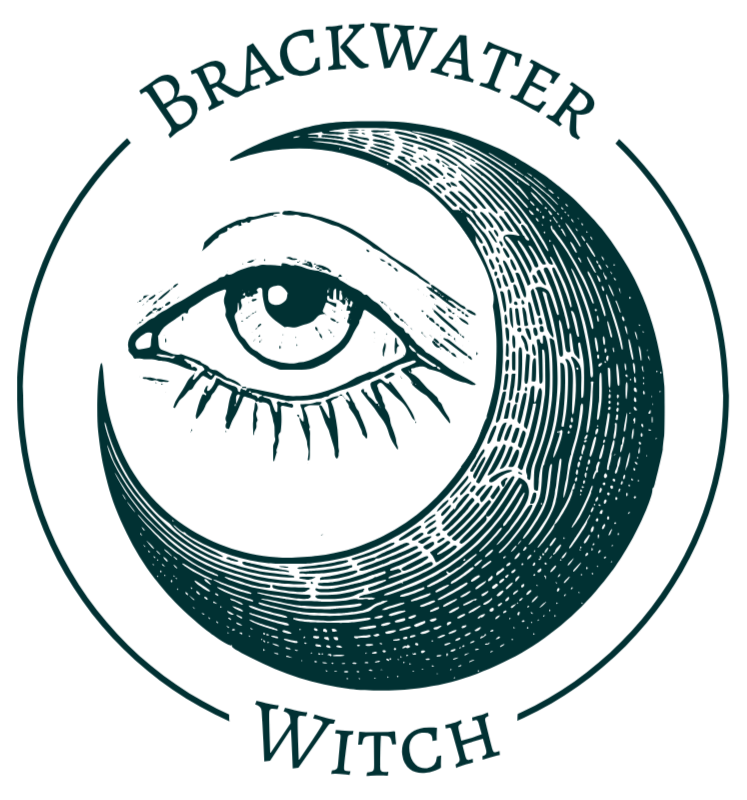 A waxing crescent moon cradling an eye surrounded by the text "Brackwater Witch"